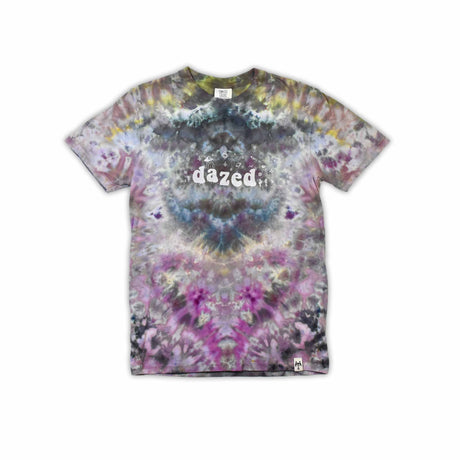 An eye-catching ice-dyed t-shirt showcasing a vibrant explosion of purples, pinks, and grays with a smoky effect around the 'dazed' text featured in the center.