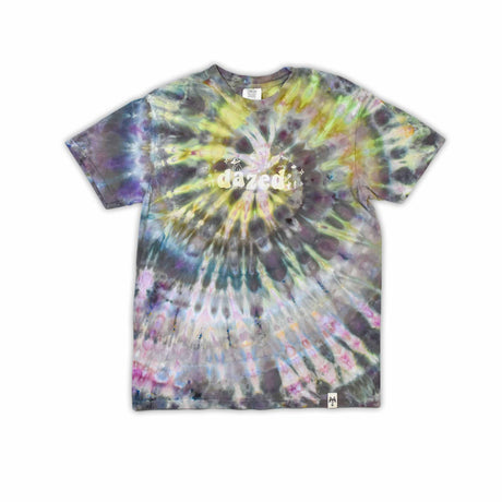 This t-shirt displays an intricate ice-dye effect that creates a starburst pattern with a mix of earthy and vibrant colors, highlighted by 'dazed' text in the middle in a style reminiscent of melting ice.