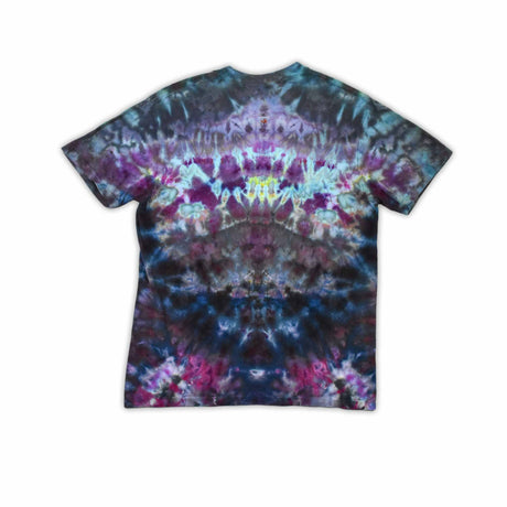 An ice-dyed t-shirt with a mesmerizing array of blues, purples, and subtle greens, reminiscent of a frozen geode, with 'dazed' in an icy font across the chest.