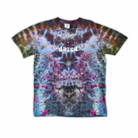 An ice-dyed t-shirt with a mesmerizing array of blues, purples, and subtle greens, reminiscent of a frozen geode, with 'dazed' in an icy font across the chest.