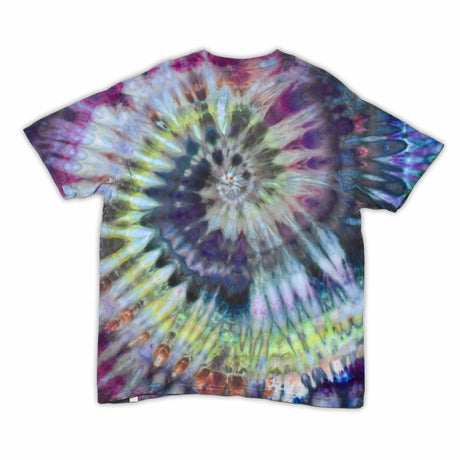 This t-shirt displays a stunning ice-dye technique creating a crystalline effect with vibrant blues, purples, and greens emanating outwards, with 'dazed' situated in the middle in a funky font.