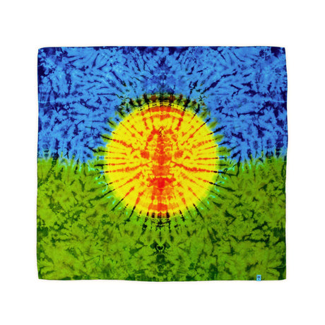 his bandana showcases a dynamic tie-dye representation of a sun with radiating beams, transitioning from a fiery orange core to a yellow halo, against a cool blue and green backdrop.
