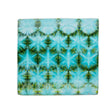 Ice-dyed cotton bandana displaying a starburst pattern of blue and green hues, with each segment forming a mirror image of its opposite.