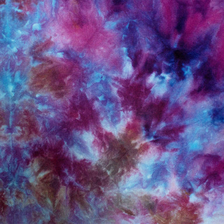 An ice-dyed bandana featuring a mirage of cool shades, where splashes of royal purple blend into pools of sapphire and lilac.