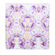 Handcrafted tie-dye bandana with a vibrant display of purple hues and white areas that symmetrically bloom into a pattern reminiscent of flowers and mandalas.