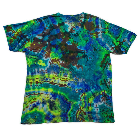 Nature-inspired reverse dyed t-shirt with circular patterns that capture the essence of a colorful geode, predominated by shades of blue and green.