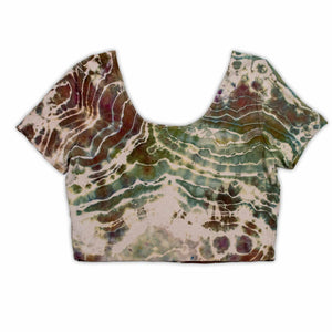 A casual, ice-dyed scoop neck top showcasing a hypnotic array of swirls and lines in colors inspired by the earth, including dark green, terracotta, and sand.