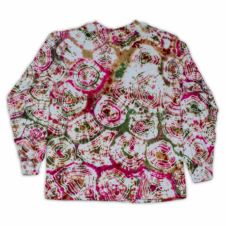 The long sleeve garment features a bold print that resembles cross-sections of gemstones, with rich pinks and greens dominating the design.