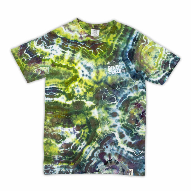 Vibrant streaks of lavender, cerulean, and jade converge in a geode-inspired ice dye pattern on this t-shirt, showcasing 'Dinkey Creek' screen printing.