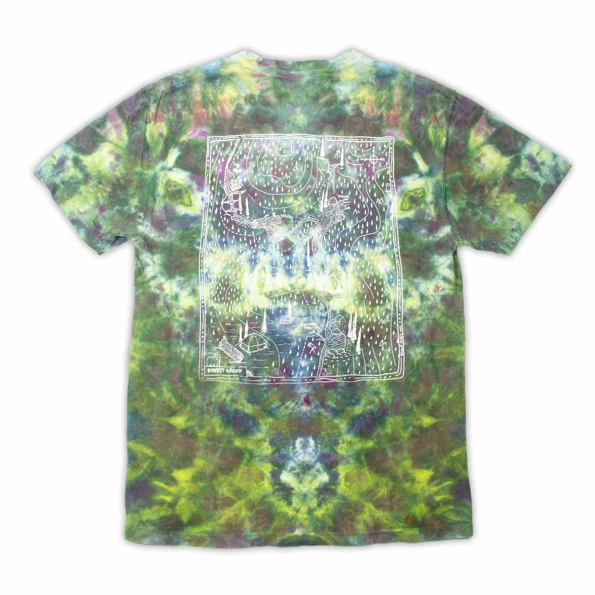 The 'Dinkey Creek' logo is subtly placed on a t-shirt with a mottled ice dye pattern in shades of green and purple, mimicking the natural variations of foliage. Features a unique 'Dinkey Creek' screen print design.