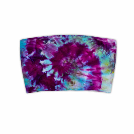 This eye-catching bandeau top showcases an intricate ice dye design with a pleated texture, displaying a burst of pink and blue hues for a bold, summer-ready look