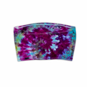 This eye-catching bandeau top showcases an intricate ice dye design with a pleated texture, displaying a burst of pink and blue hues for a bold, summer-ready look