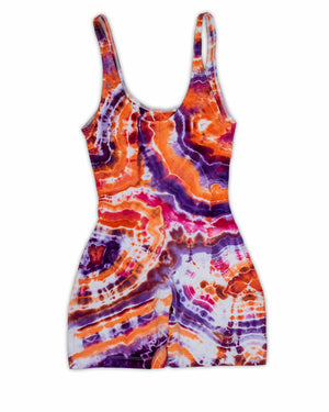 An electric ice-dyed jumpsuit with psychedelic patterns that dance across the fabric in hues of electric violet, burnt orange, and deep purple..