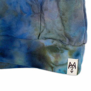 Envelop yourself in the warmth of this cozy hoodie, artistically ice-dyed in a blend of tranquil blues and earthy greens.