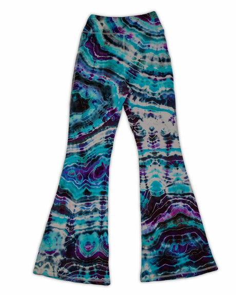 A pair of hand-dyed pants showcasing a unique ice-dye technique with organic patterns in a striking combination of sapphire, violet, and seafoam green.