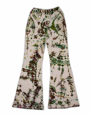 A pair of ice-dyed wide-leg pants that evoke the colors of the earth, with detailed patterns in shades of sage, wine, and sandstone.