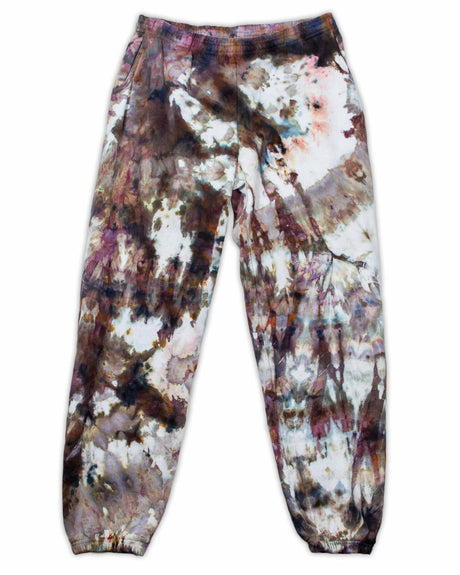 Comfortable sweatpants with a complex ice-dyed pattern in earthy browns and purples, interspersed with patches of soft white.