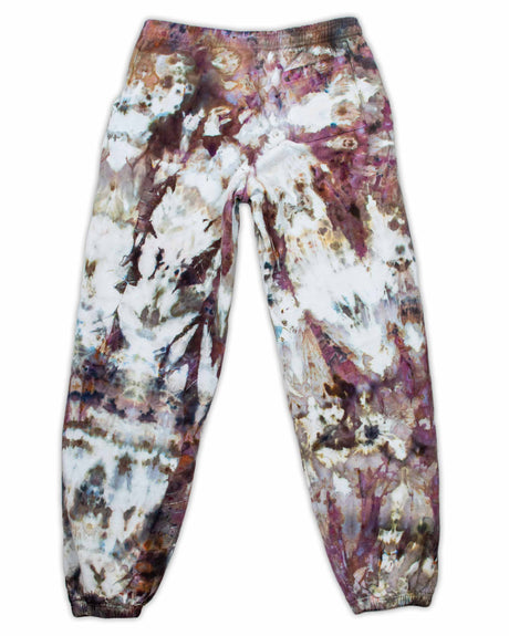 Comfortable sweatpants with a complex ice-dyed pattern in earthy browns and purples, interspersed with patches of soft white.
