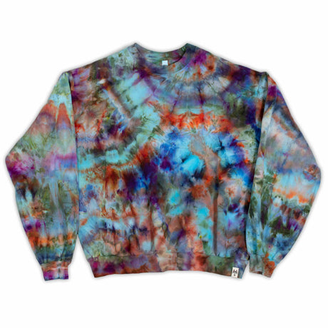 A cozy, long-sleeved sweatshirt boasts a comforting array of tie-dye patterns in cool blues, greens, and warm rust, inviting a sense of warmth and style."